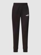 PUMA PERFORMANCE Sweatpants mit Label-Print in Black, Größe S