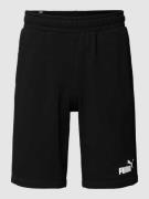 PUMA PERFORMANCE Sweatshorts mit Label-Print Modell 'ESS' in Black, Gr...