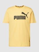 PUMA PERFORMANCE T-Shirt mit Label-Print in Dunkelgelb, Größe XL