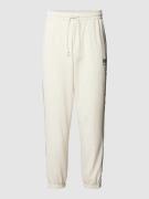 PUMA PERFORMANCE Sweatpants mit Logo-Stitching in Offwhite, Größe M