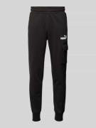 PUMA PERFORMANCE Slim Fit Sweatpants mit Cargotasche in Black, Größe L