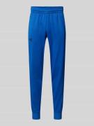 Under Armour Loose Fit Sweatpants mit seitlichen Eingrifftaschen in Ra...