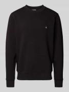 Calvin Klein Jeans Sweatshirt mit Label-Patch in Black, Größe L