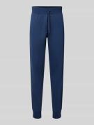 CHAMPION Slim Fit Sweatpants mit elastischen Beinabschlüssen in Marine...