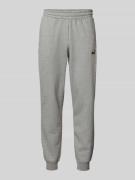 PUMA PERFORMANCE Sweatpants mit Logo-Stitching in Mittelgrau Melange, ...