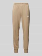 PUMA PERFORMANCE Regular Fit Sweatpants mit Label-Print in Beige, Größ...