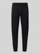 Tommy Jeans Slim Fit Sweatpants aus Baumwoll-Mix in Black, Größe S