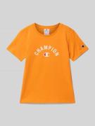 CHAMPION T-Shirt mit Label-Print in Orange, Größe 128