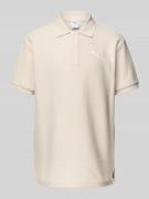PUMA PERFORMANCE Relaxed Fit Poloshirt mit Label-Stitching in Offwhite...
