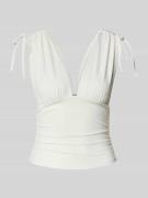 Gina Tricot Top mit V-Ausschnitt und Schnürung in Offwhite, Größe M