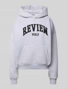 Review Oversized Hoodie mit Label-Print in Hellgrau Melange, Größe L