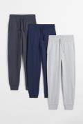 H&M 3-Pack Joggpants aus Baumwolljersey Dunkelblau/Graumeliert, Joggin...