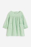 H&M Kleid mit Taschen Hellgrün/Geblümt, Kleider in Größe 74. Farbe: Li...